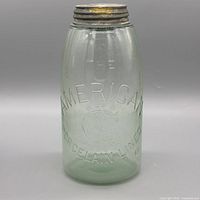 Full view of embossed glass canister front