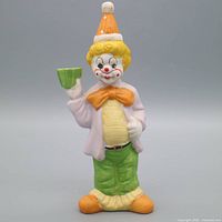 Front view of chalkware clown figurine showing colors and posture