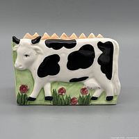 front view showing cow relief and floral base