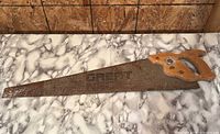 Full view of Great hand saw on tabletop