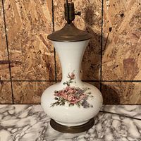 Full view of porcelain floral lamp showing body, base and socket