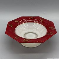 Top view of octagonal red and white glass compote showing gold laurel pattern