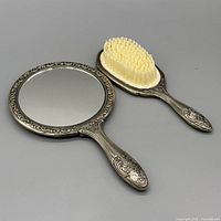 Mirror and brush full view showing style and condition