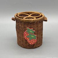 Front view showing wicker holder and strawberry decoration