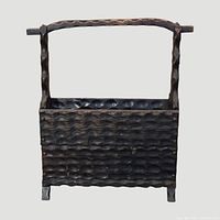 Front view of carved wood rack showing handle and texture