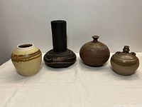 Front view of all four vases