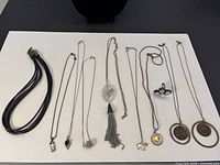 Group shot of all necklaces and ring laid out
