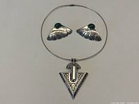 Full view of collar necklace and earrings