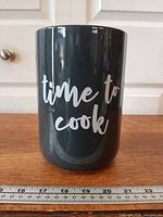 Front view of crock showing text