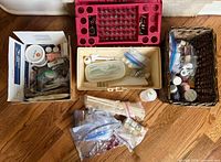 Overview of entire lot showing boxes, case, basket, bags and dowels