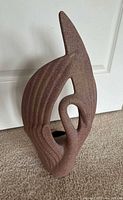 Front view of abstract mauve speckle ceramic planter sculpture