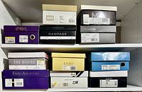 Shelved shoeboxes showing brand labels and sizes
