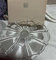 Top view of crystal cake stand next to Mikasa box