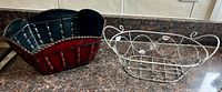 Both metal baskets on countertop showing overall design and relative size