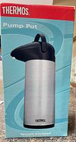 Front of retail box showing Thermos pump pot image and branding