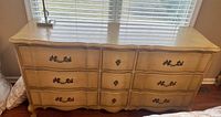 Front view of 9-drawer dresser showing style, finish and hardware