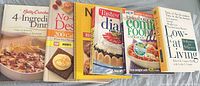 Front view of six cookbooks standing side by side