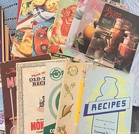 All booklets fanned out, showing variety and covers