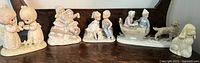 Group shot of all six figurines on shelf