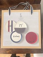 Retail box front showing four plate designs and branding