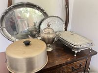 Group view of all five silver-plated serving pieces