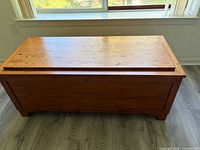 Closed cedar chest, exterior finish and overall shape visible