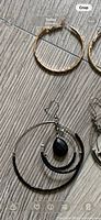 Close-up multi-loop hoop and gold hoop