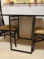 Table and chairs overview, detached leaf visible