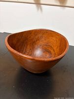 Asymmetrical wooden serving bowl showing interior and grain