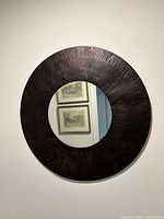 Front view of round mirror on wall