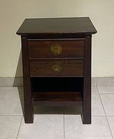 Full front view of side table showing drawers, shelf, hardware