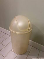Cream swing-lid bin front view
