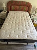Mattress on adjustable base, top view showing quilt pattern and headboard