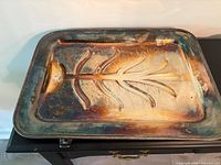 top view of silver-plated carving platter with tree design