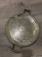Top view of ornate etched tray with handles
