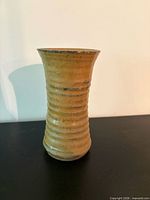 Brown ribbed stoneware vase front view