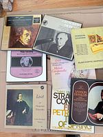 Assorted single LPs and boxed sets with Debussy, Liszt, Couperin, Stravinsky titles visible