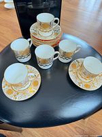 Full set of cups and saucers displayed
