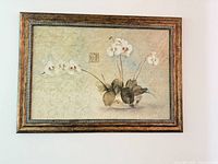 Front view of framed floral canvas showing artwork and frame detail