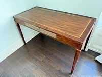 Angled top view showing inlaid border and desk surface