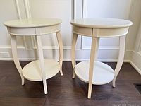 Both matching round end tables front view