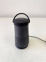 Front view of Bose SoundLink Revolve+ speaker showing cylindrical design and grille