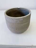 Front view of gray concrete planter