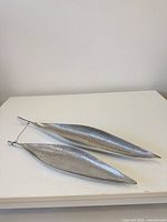 both hammered aluminum trays side by side on table