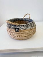 Full view of basket showing brand tag and handles
