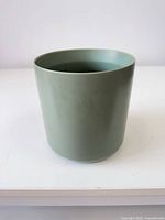 Full view of ceramic planter, matte sage green finish