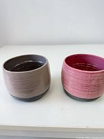 Both ceramic planters side by side showing colors and size