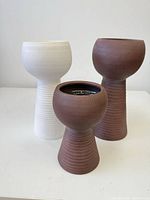 Front view of all three planters showing color and form