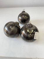 All three large mercury glass ornaments grouped