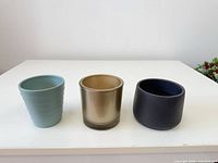 group shot of all three small planters